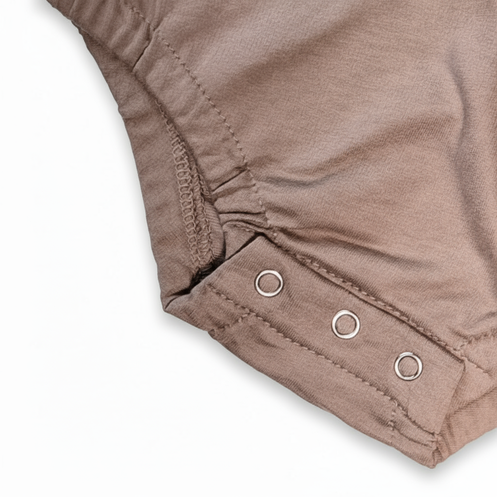 Close-up of a brown fabric with button details on a white background